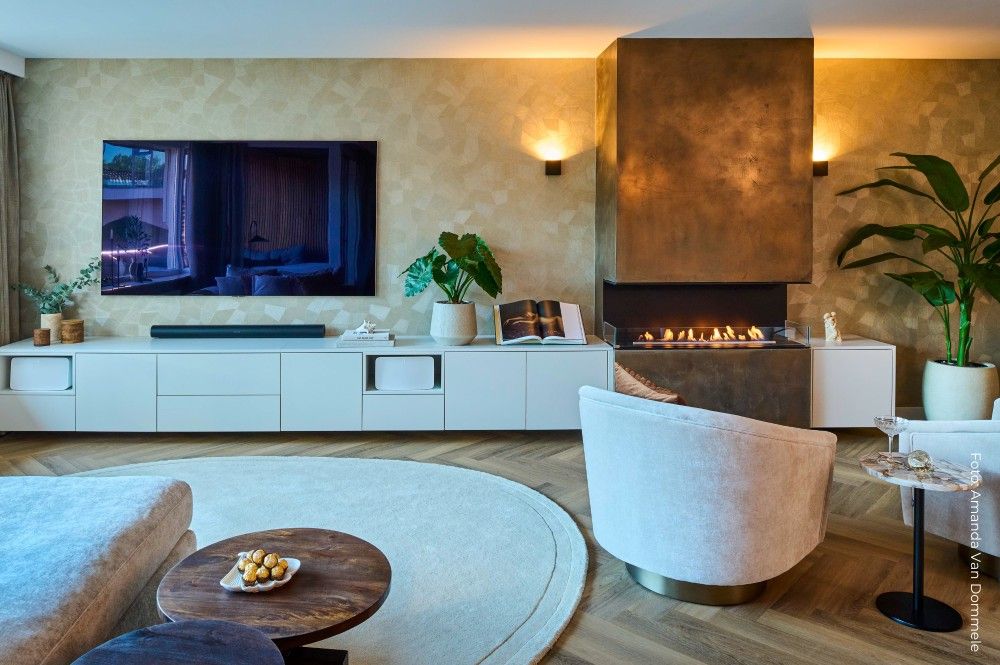 Corner fireplace under a copper hood